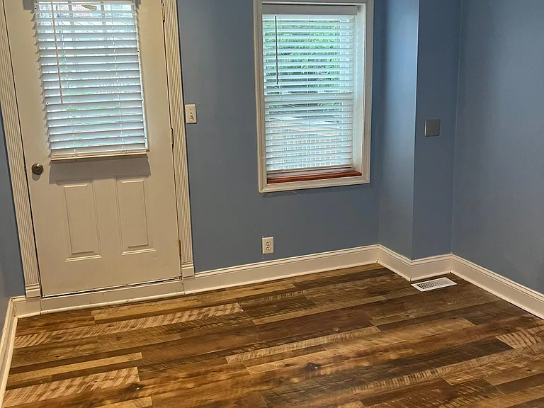 Master bedroom and doorway to deck