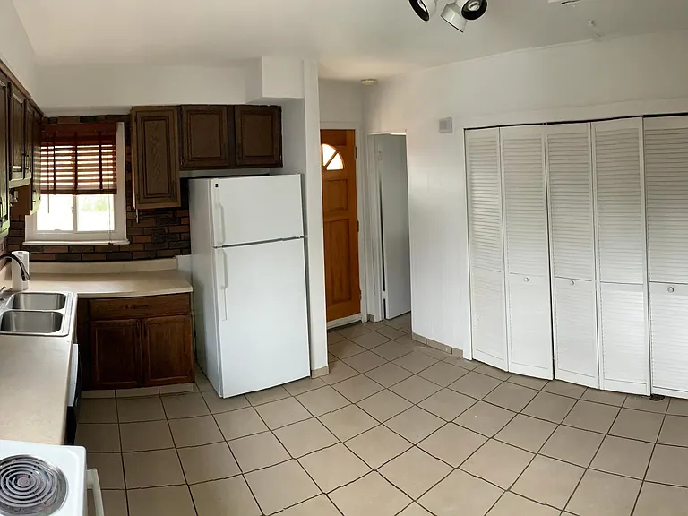 Kitchen with Range, Dishwasher, Garbage Disposal, Refrigerator and Pantry. + Door to backyard (ANGLE 2)