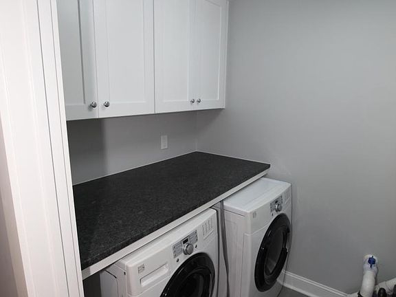 Laundry room with HE washer and dryer