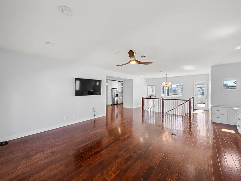 living room with view of toward the kitchen & dining room