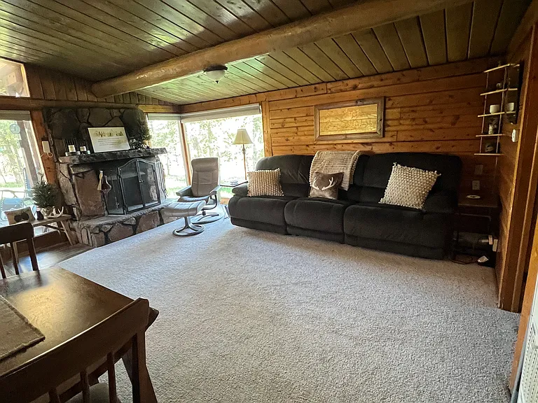 New carpet and couch with electrical recliners in the couch.