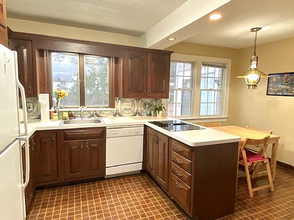 Nice size eat in kitchen with double oven, range top, DW and refrigerator.
