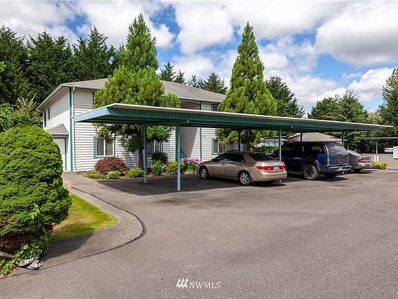 Welcome to Midland Court Condominiums! Unit 3 comes with 2 reserved carport spots