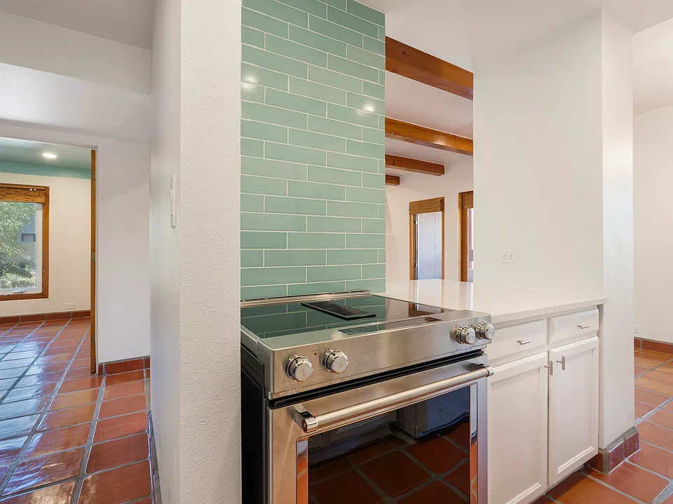 Newly redone kitchen with downdraft range and bar