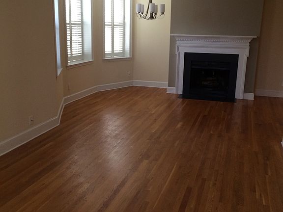 living room/dining room w/ wood-burning fireplace