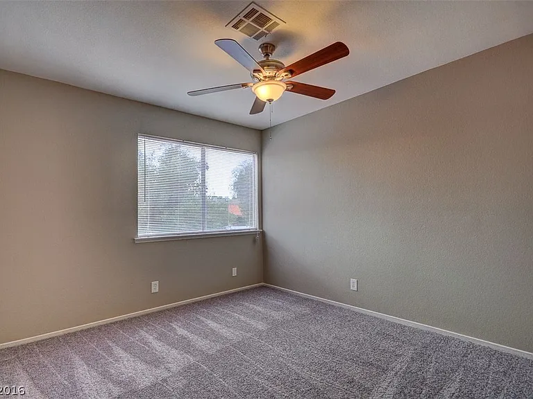 The flooring has been upgraded to laminate_there is no longer any carpet in this room