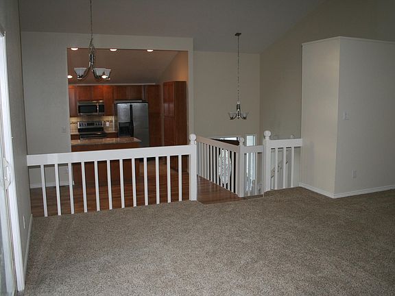 Upstairs family room looking into dining and kitchen