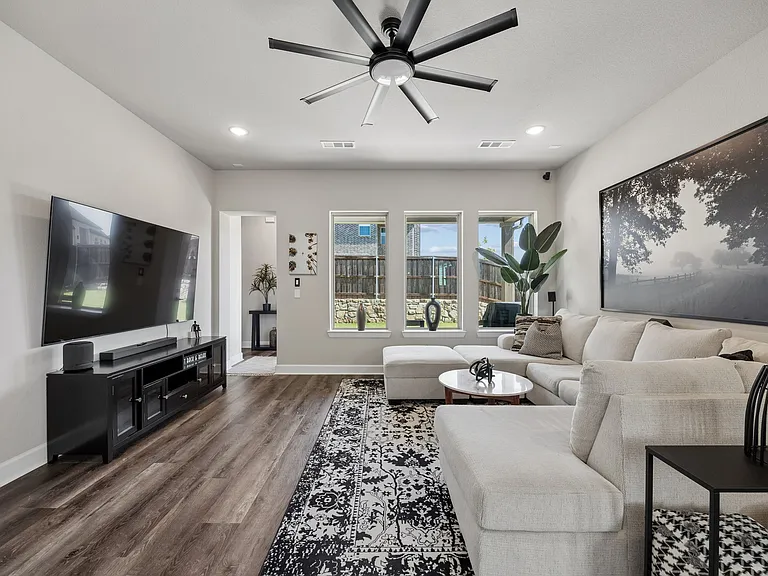 Cozy family room, great for entertaining and movies. Large windows for great natural light and back yard view