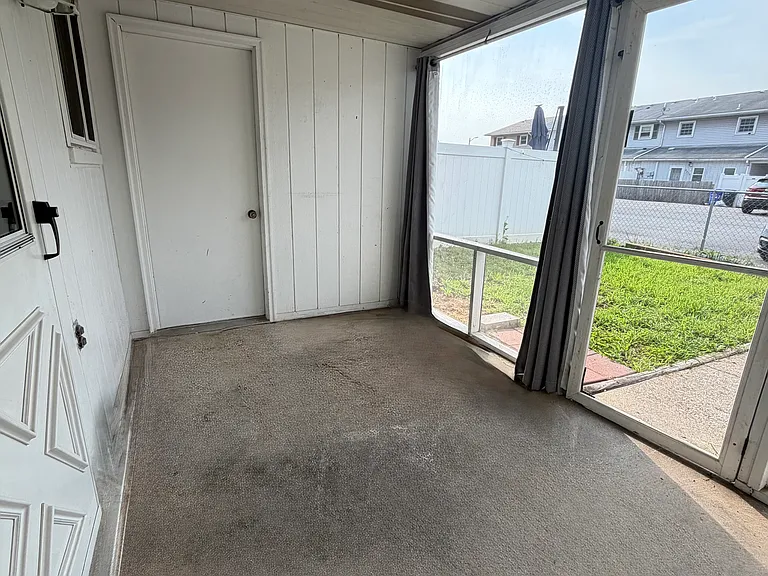 Enclosed sunroom and a storage room