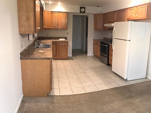 Updated kitchen with tile floor and backsplash