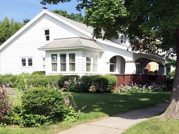 Side of house with multi use sun room shown