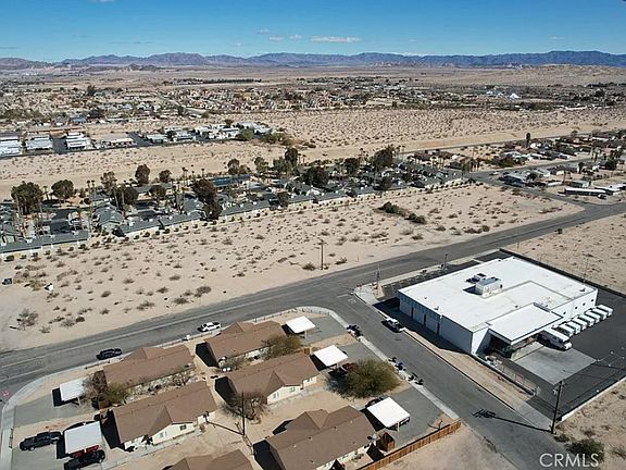 Overhead view property is top right on corner across from Post Office