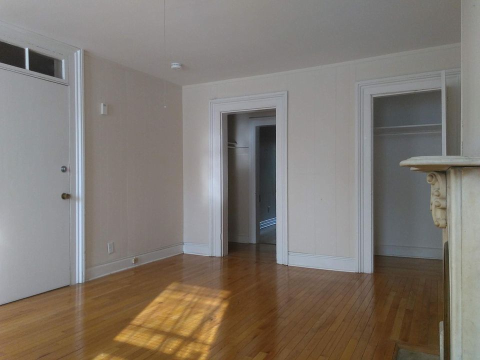 view of west facing front room with closet