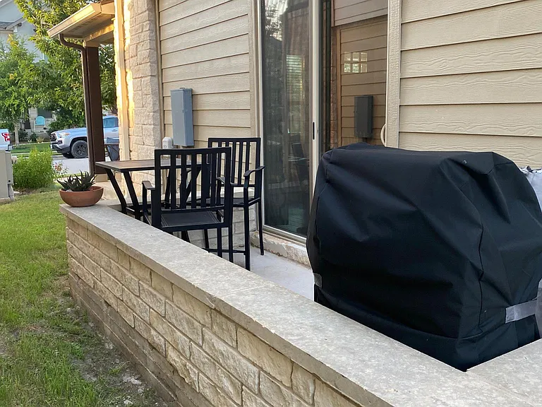 Side patio for outdoor grilling and relaxation!