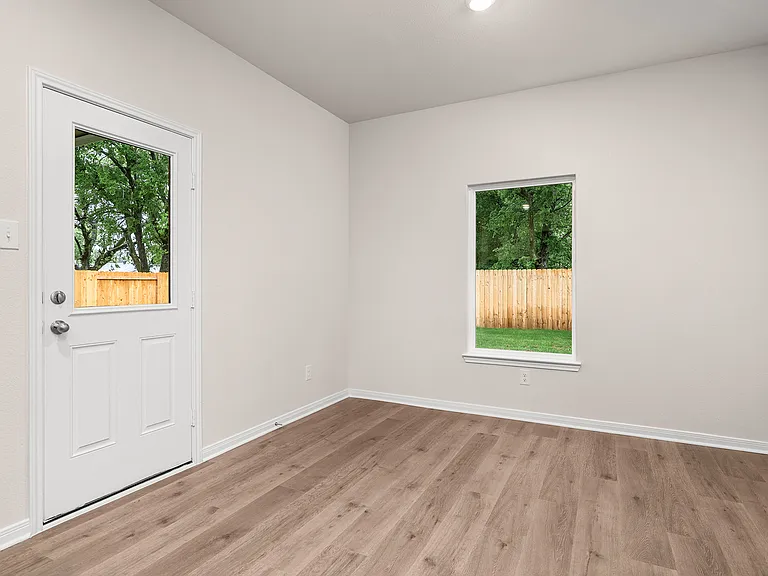 The dining room has large windows that let in great, natural light.