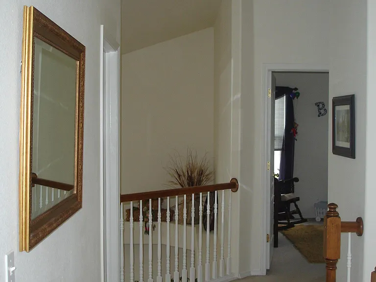 Upstairs landing. Master behind. Bedroom to the left and another straight ahead. Bathroom around to the right.