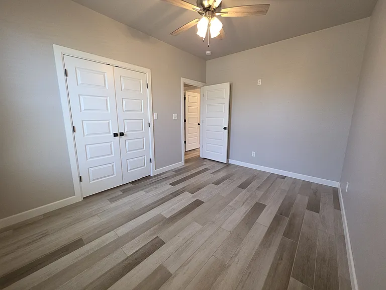 Neutral tones make this nice sized bedroom a breeze to decorate.