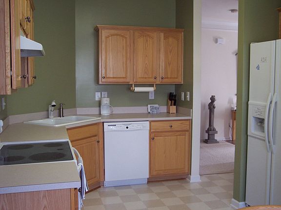 Eat in Kitchen with upgraded appliances and large pantry.
