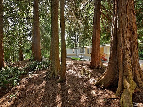 Tucked away in a cedar grove, enjoy the peace & beauty of nature right outside your front door.