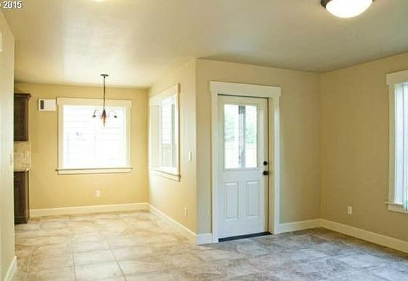 View of dining area and door to back yard