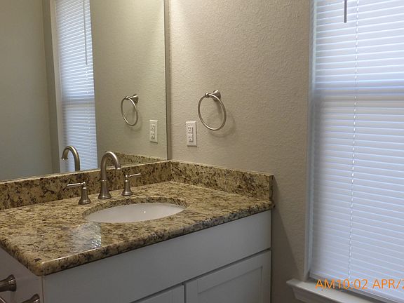 Master bath vanity has granite countertop; also has lovely shower
