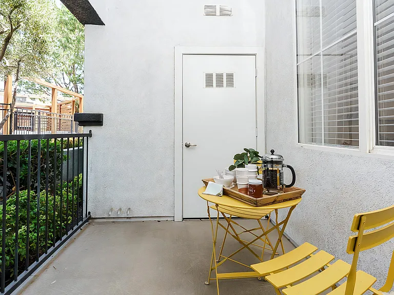 Private Apartment Patio with Bistro Table and Outdoor Seating