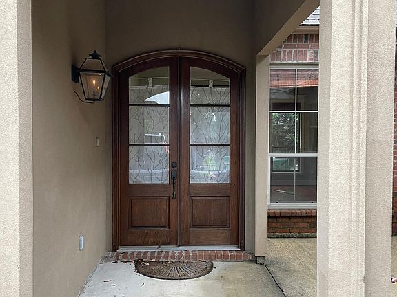 Double door entry with gas lantern