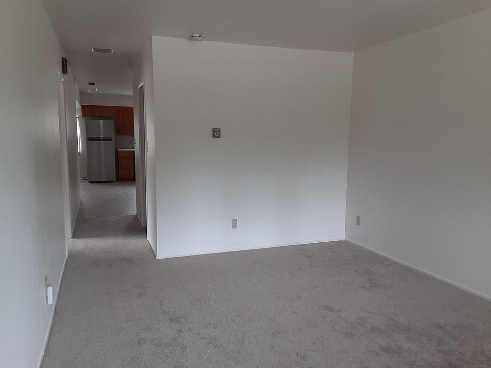 Living room facing hall to kitchen