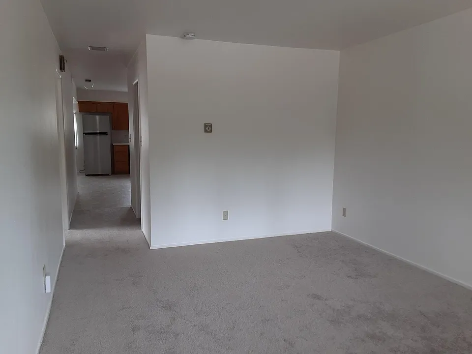 Living room facing hall to kitchen