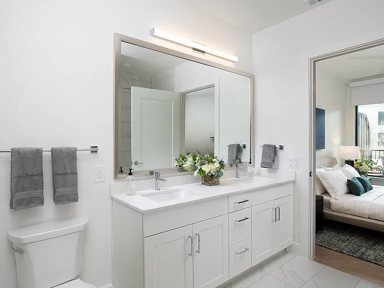 Large vanities and mirrors provide plenty of space.