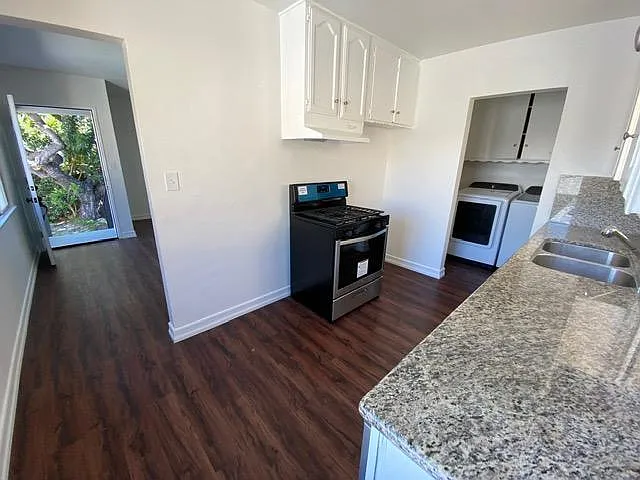 Kitchen has granite counter tops, brand new gas stove oven. State of the art washer, dryer, and dishwasher.