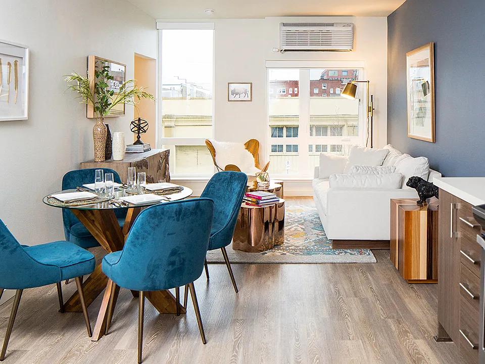 Open-concept living space with dining area and stylish kitchen.