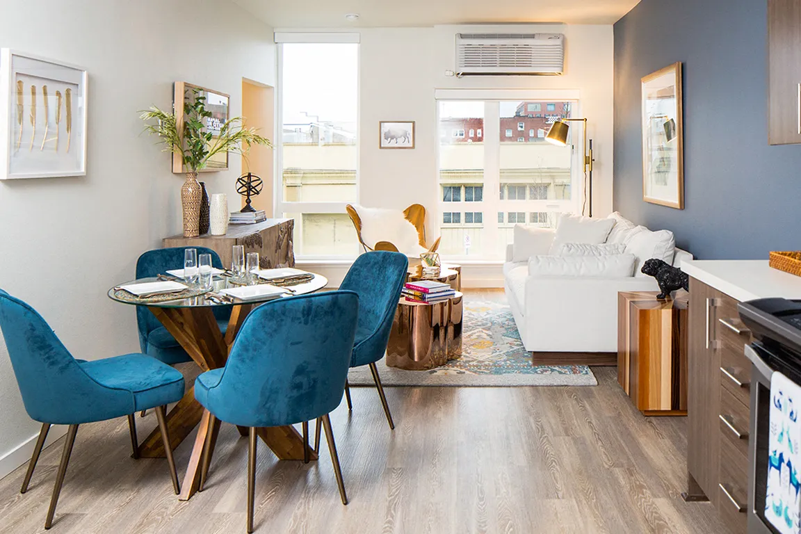 Open-concept living space with dining area and stylish kitchen.