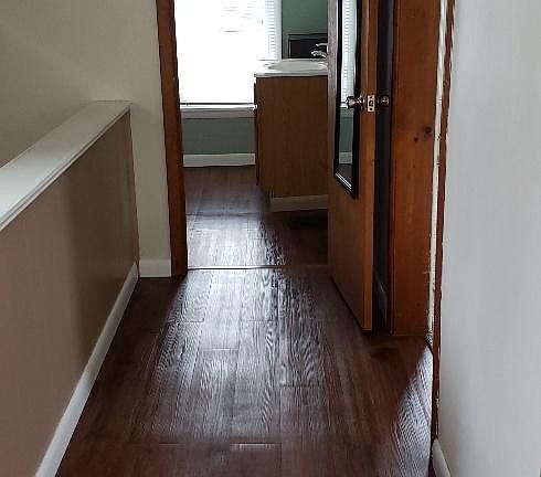 Hallway to bath and LvRm to the right