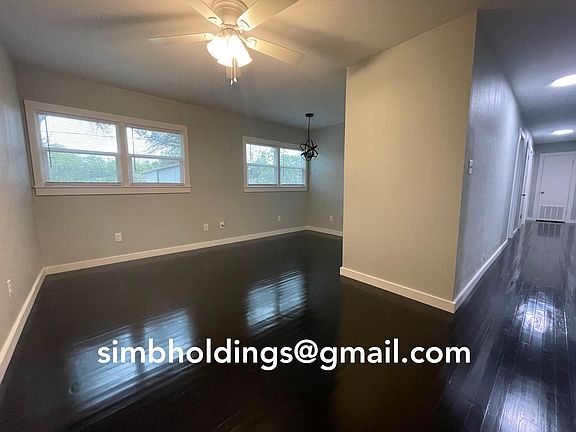 Living room, dining room and hallway to bedrooms. These gorgeous hardwood floors are 70 years old!
