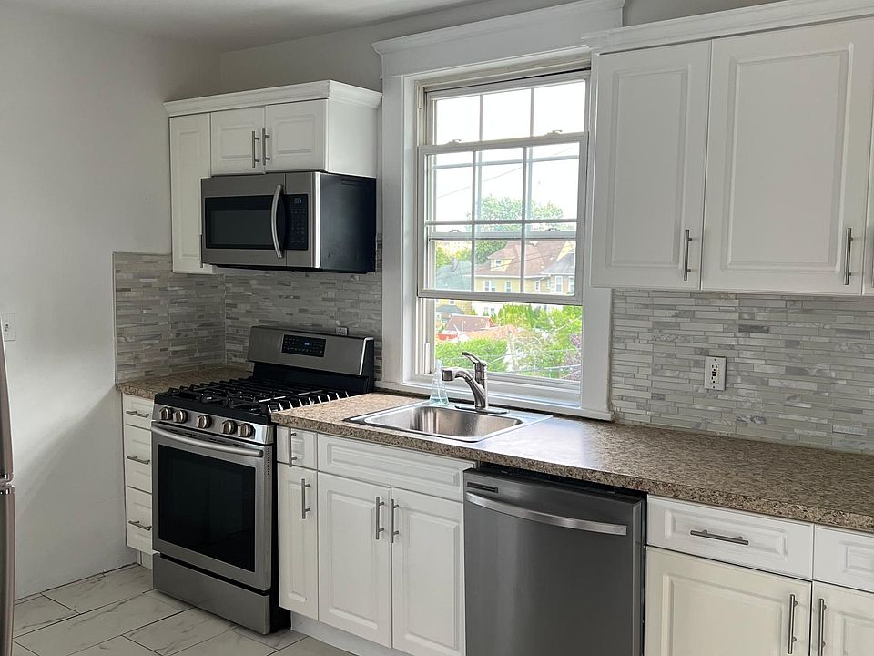 Kitchen with stainless steel appliances.
