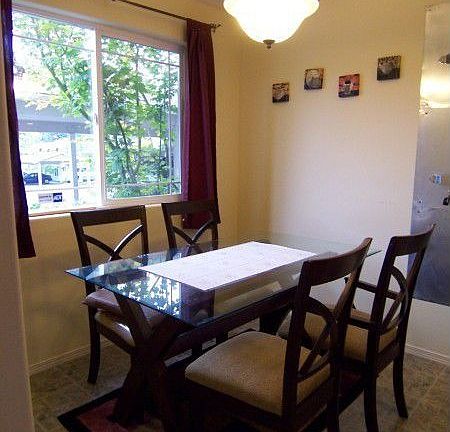 Eating nook w/large window for lots of light; open to kitchen just steps away; wall pot rack for add