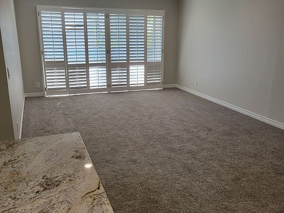 Large living room with recessed lighting.