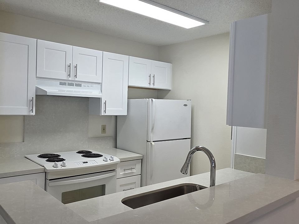Renovated Kitchen with New Cabinets and Quartz Countertops