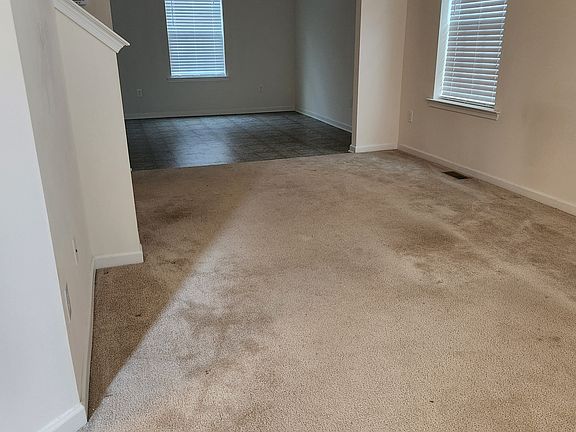 Living room opening into dining - open floorplan