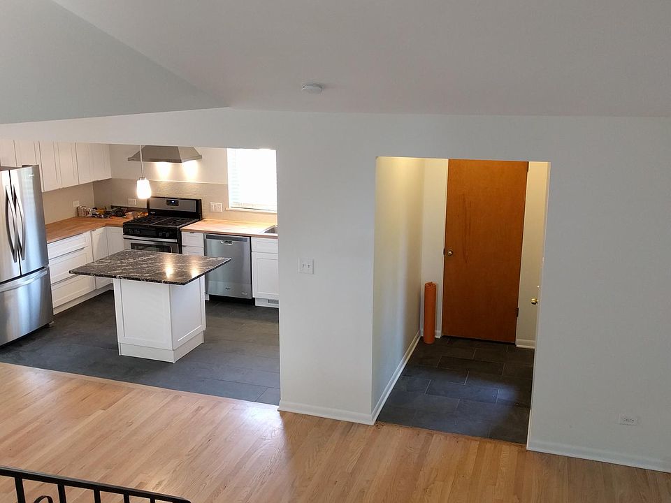 Vaulted ceiings, bright open concept, kitchen, dining room, living room.