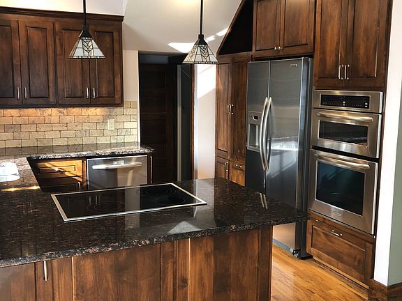 Custom kitchen with soft-close cupboards and built in sliders and pull-outs for maximum storage.