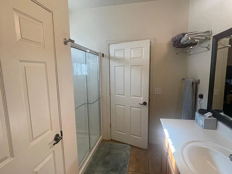 Master bathroom view from walk in closet