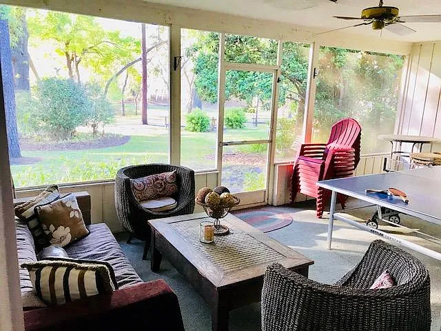 Enjoy the pond and park view from the screened porch and large sliding glass doors of living room