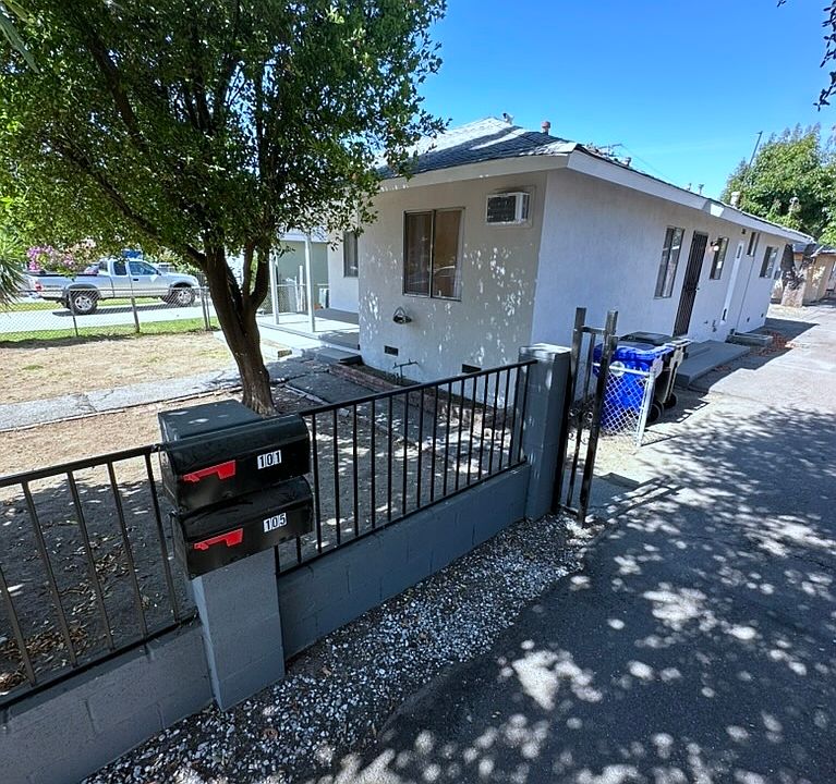 The property is fenced and gated with a manual gate.