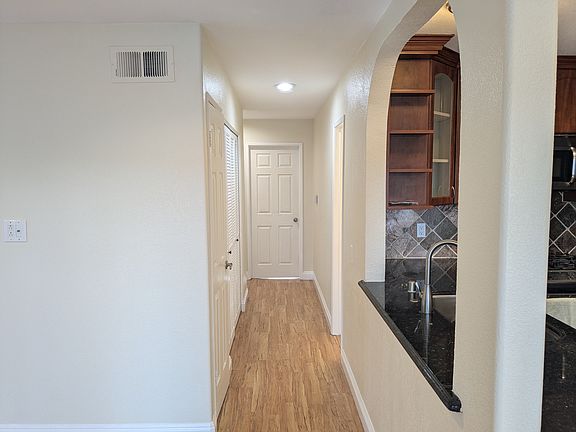 Hallway to bathroom and 3 bedrooms