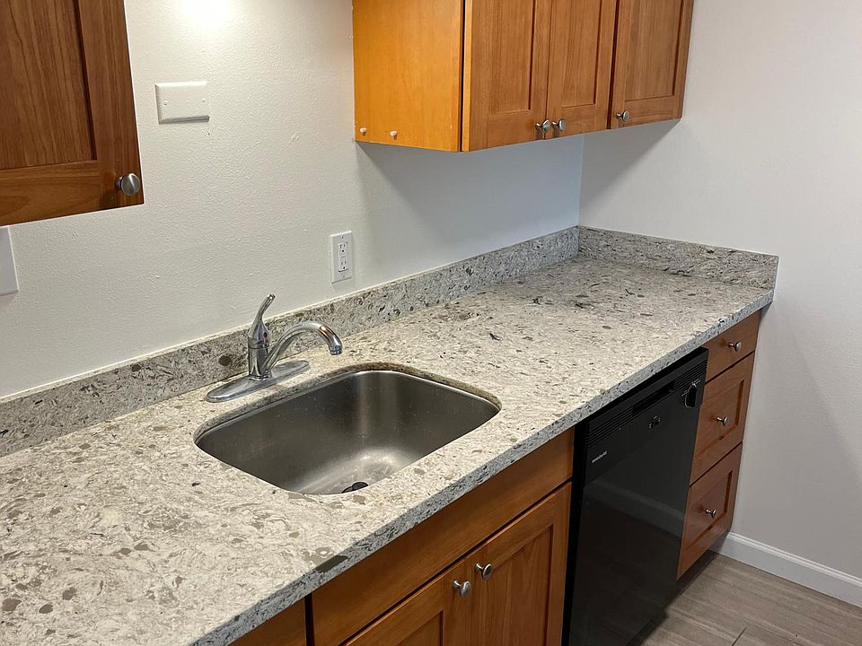 Kitchen with wood cabinets and dishwasher