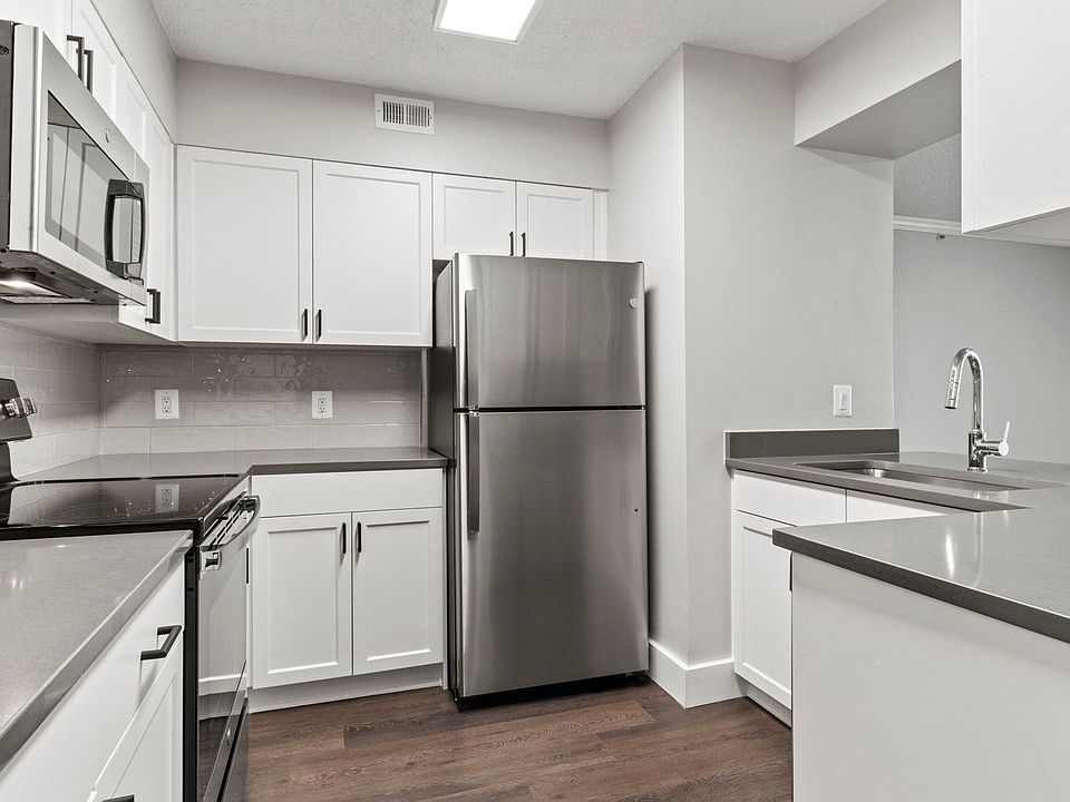 Select homes have upgraded kitchens with quartz countertops and wood flooring