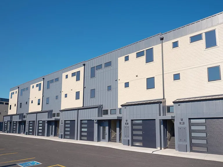 Attached garage on 1st level with 13' high ceilings, insulated and heated with smart opener technology.