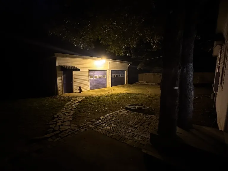 Large workshop at night - new garage door
Openers and driveway that leads to the garage. Shed on the left for extra storage.